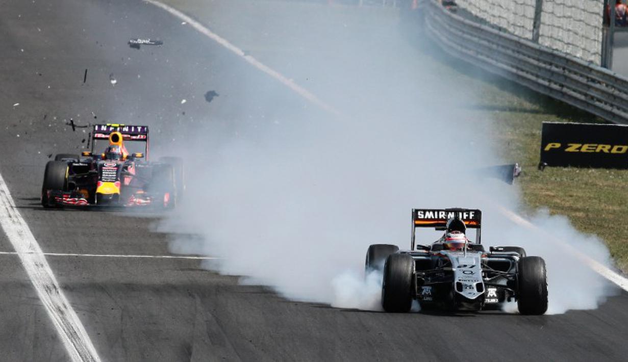 Mobil pebalap Sahara Force India, Nico Huelkenberg, mengalami kerusakan di tengah lomba. (AFP PHOTO/Ferenc Isza)