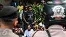 Ratusan orang Papua yang berdomisili di Pulau Jawa dan Bali melakukan aksi turun ke jalan memperingati 1 Desember di Bundaran HI, Jakarta, Selasa (1/12). Tanggal 1 Desember juga diartikan sebagai hari kemerdekaan Papua. (Liputan6.com/Faizal Fanani)
