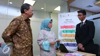 Direktur Utama BEI Tito Sulistio bersama dengan Kepala Eksekutif Pengawas Pasar Modal OJK Nurhaida saat meresmikan Pusat Informasi Go Public di Bursa Efek Indonesia, Jakarta, Senin, (27/6). (Liputan6.com/Angga Yuniar)