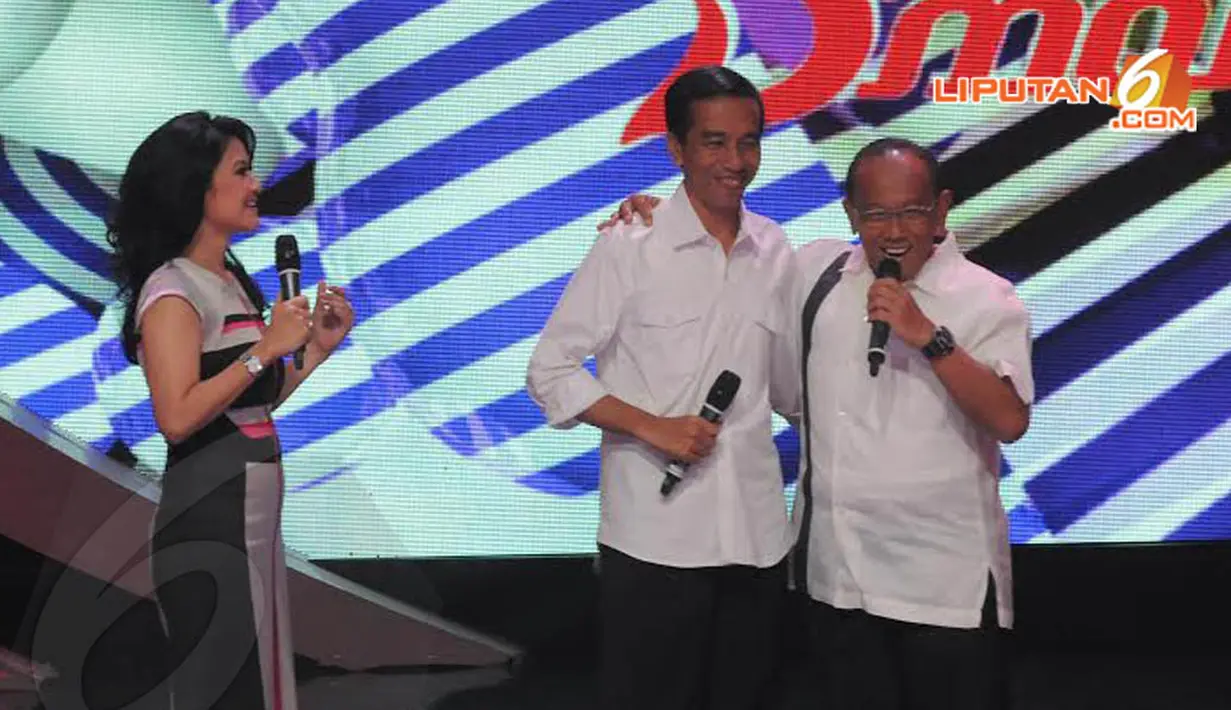  Jokowi dan Ical pun tampak berangkulan dan tetap hangat meski dalam bursa capres harus bersaing (Liputan6.com/Herman Zakharia) 