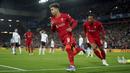 Pemain Liverpool Roberto Firmino melakukan selebrasi usai mencetak gol ke gawang Benfica pada pertandingan sepak bola leg kedua perempat final Liga Champions di Stadion Anfield, Liverpool, Inggris, 13 April 2022. Pertandingan berakhir dengan skor 3-3. (AP Photo/Jon Super)