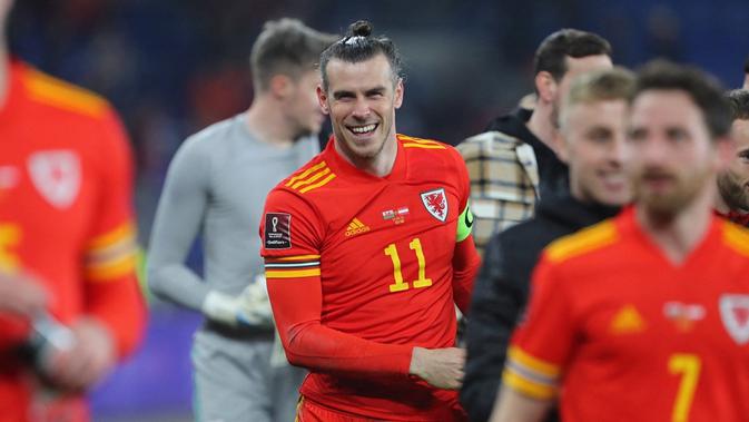 Winger Timnas Wales, Garteh Bale, berhasil mencetak dua gol kemenangan timnya atas Austria pada laga semifinal Path C play-off kualifikasi Piala Dunia 2022 di Cardiff City Stadium, Jumat (25/3/2022) dini hari WIB. (AFP/Geoff Caddick)