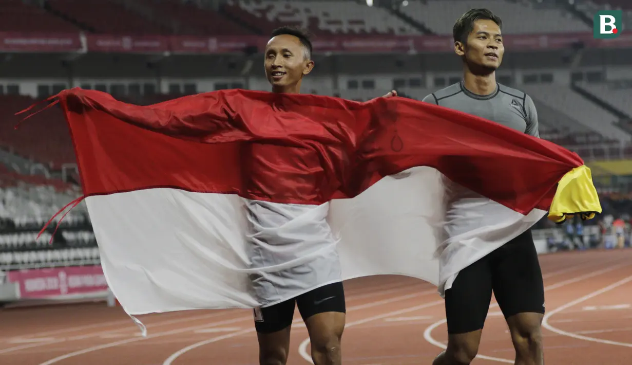 Pelari Indonesia, Abdul Halim Dalimunthe, melakukan selebrasi usai finis di posisi dua nomor 100M T11 pria pada Asian Para Games di SUGBK, Jakarta, Rabu (10/10/2018). Abdul Halim meraih medali perak. (Bola.com/M Iqbal Ichsan)