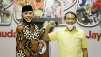 Menteri Pemuda dan Olahraga (Menpora) Zainudin Amali bersama Ketua Umum PSSI Mochamad Iriawan memberikan keterangan pers kepada wartawan terkait persiapan penyelenggaraan Piala Dunia U-20 2021 di Media Center Kemenpora, Jakarta, Jumat (3/7).