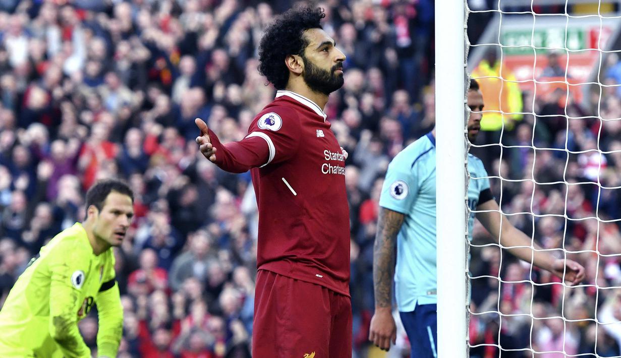 Ekspresi pemain Liverpool, Mohamed Salah usai membobol gawang AFC Bournemouth pada lanjutan Premier League di Anfield stadium, Liverpool,(14/4/2018). Liverpool menang 3-0.  (Anthony Devlin/PA via AP)