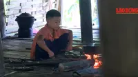 Dang Van Khuyen, bocah berusia 10 tahun yang tinggal sendiri di sebuah desa terpencil di Vietnam (Dok.YouTube/ Lao Động TV)