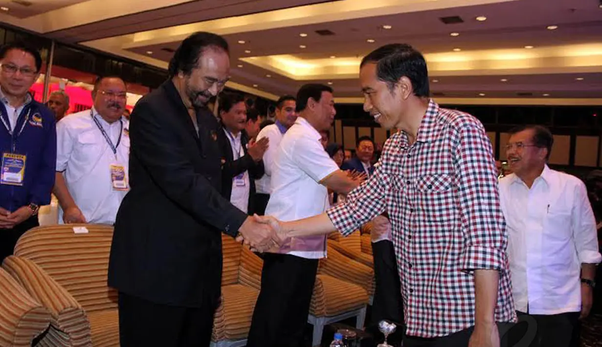 Capres Jokowi yang diusung koalisi PDIP, Nasdem, PBK, Hanura, dan PKP tampak ikut menghadiri   Rakernas Partai Nasdem (Liputan6.com/JohanTallo) 