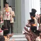 Presiden Joko Widodo (Jokowi) seusai memimpin pelantikan pengurus Kwartir Nasional Gerakan Pramuka masa bakti 2018-2023 di Istana Merdeka, Kamis (27/12). Jokowi melantik Budi Waseso sebagai Ketua Kwarnas Gerakan Pramuka. (Liputan6.com/Angga Yuniar)