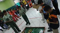 Kompetisi robotic se-Jatim diselenggarakan di SMP Alfalah Deltasari, Sidoarjo, Jawa Timur pada Sabtu, 15 Februari 2020. (Foto: Liputan6.com/Dian Kurniawan)