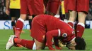 Gelandang Liverpool, Mohamed Salah sujud merayakan gol yang dicetaknya ke gawang Watford pada laga Premier League di Stadion Anfield, Liverpool, Sabtu (17/3/2018). Liverpool menang 5-0 atas Watford. (AFP/Lindsey Parnaby)