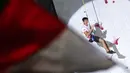 Reaksi atlet panjat tebing Indonesia, Kiromal Katibin merayakan kemenangan pada perebutan juara ketiga nomor speed putra Kejuaraan Dunia Panjat Tebing IFSC 2023 seri Jakarta melawan atlet panjat tebing China, Xinshang Wang di Lot 6, Kompleks Stadion Utama Gelora Bung Karno, Jakarta, Indonesia, Minggu (07/05/2023). (Bola.com/Bagaskara Lazuardi)
