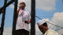 Aksi pendukung Mantan Menteri Agama Suryadharma Ali saat berorasi di depan Pengadilan Negeri Jakarta Selatan, Senin (30/3/2015). Sidang gugatan praperadilan SDA ditunda hingga besok, Selasa (31/3). (Liputan6.com/Yoppy Renato)