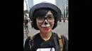 Dalam aksi tersebut, massa mengenakan dresscode hitam dengan lukisan aneka satwa di wajah mereka, Jakarta, (12/10/14). (Liputan6.com/Miftahul Hayat)
