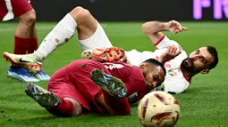 Uniknya, ketiga gol kemenangan Qatar dicetak melalui titik putih. (Jewel SAMAD/AFP)