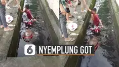 Aksi standing motor yang dilakukan oleh bocah ini ternyata menjadi penyebabnya ia nyemplung ke dalam got bersama motornya.