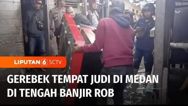 Polres Pelabuhan Belawan menggerebek sebuah rumah yang dijadikan tempat praktik judi di kawasan padat penduduk di Kota Medan, Sumatera Utara. Penggerebekan dilakukan meski pada saat yang sama banjir air pasang atau rob melanda.