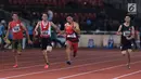 Atlet para-atletik Indonesia, Sapto Yogo Purnomo (ketiga kiri) saat laga lari nomor 100 meter T37 pria yang  digelar di Stadion GBK, Jakarta, Selasa (9/10). Ini menjadi medali emas kedua Sapto di Asian Para Games 2018. (Liputan6.com/Helmi Fithriansyah)