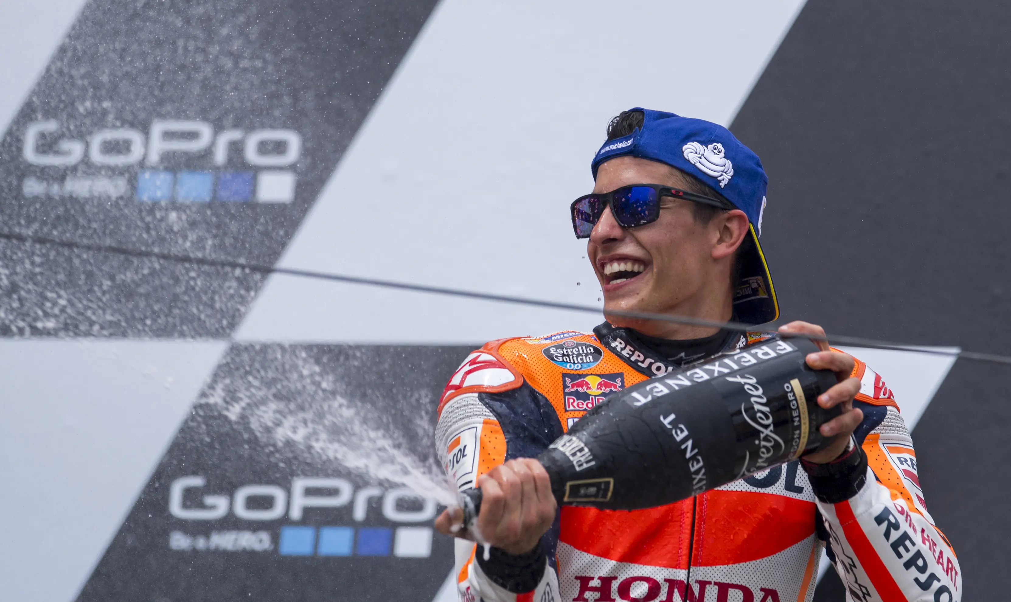 Pembalap Repsol Honda, Marc Marquez saat merebut podium juara MotoGP Jerman 2016. (AFP)