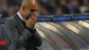 Wajah lesu Pep Guardiola usai melihat timnya dipermalukan 1-3 dari Porto  (REUTERS/Miguel Vidal)