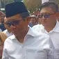 Bakal calon wakil presiden (Bacawapres) Mahfud MD tiba di Tugu Proklamasi, Jakarta, Kamis (19/10/2023). Mahfud didampingi oleh sang istri, Zaizatun Nihayati (Liputan6.com/Delvira Hutabarat)