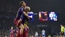 Gelandang Barcelona asal Spanyol, Daniel Olmo (kanan) merayakan gol bersama Fermin Lopez usai mencetak gol pada pertandingan pekan ke-18 Liga Spanyol 2025/2026 melawan RCD Espanyol di Stadion RCDE, Sabtu 3 Januari 2026 waktu setempat atau Minggu (4/1/2026) dini hari WIB. Derbi Catalunya antara RCD Espanyol dan Barcelona pada pekan ke-18 Liga Spanyol 2025/2026 berakhir dengan kemenangan Blaugrana. (MANAURE QUINTERO/AFP)