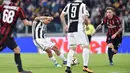 Aksi pemain Juventus, Paulo Dybala melepaskan tembakan ke gawang AC Milan pada laga Serie A di Allianz Stadium, Turin, (31/3/2018). Juventus menang 3-1. (Alessandro Di Marco/ANSA via AP)