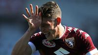 Penyerang Torino, Andrea Belotti, merayakan gol yang dicetaknya ke gawang AS Roma pada laga Serie A di Stadion Grande Torino, Turin, Minggu (25/9/2016). (AFP/Marco Bertorello)