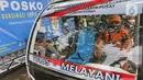 Kendaraan pengantar peserta vaksinasi COVID-19 di Kampung Tangguh Jaya Cideng, Jakarta, Sabtu (10/4/2021). Adapun sasaran program vaksinasi massal ini kaum lanjut usia (lansia) dan pelayan publik yang sering berinteraksi dengan masyarakat. (Liputan6.com/Herman Zakharia)