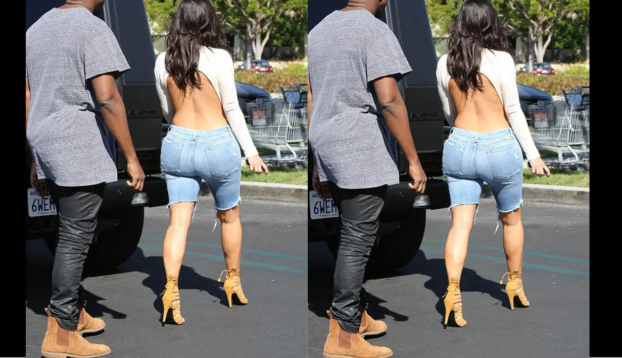 Kim Kardashian tampak seksi dengan busana yang memperlihatkan punggungnya saat kencan dengan Kanye West di kawasan Calabasas, Los Angeles, (19/10/14). (Dailymail)
