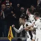 Selebrasi Cristiano Ronaldo pada laga kedua, babak 16 besar Liga Champions yang berlangsung di Stadion Allianz, Turin, Rabu (13/3). Juventus menang 3-0 atas Atl Madrid. (AFP/Filippo Monteforte)