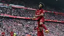 Pemain Liverpool, Mohamed Salah merayakan gol kemenangan timnya pada laga pekan ke-32 Liga Inggris 2022/2023 di Anfield, Liverpool, Sabtu (22/04/2023) WIB. The Reds berhasil menang dengan skor 3-2. (AFP/Paul Ellis)