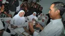 Kunjungan Jokowi ke SMPN 277 dalam rangka mengecek keberlangsungan Kartu Jakarta Pintar (KJP) di sekolah itu, Jakarta, (23/9/14). (Liputan6.com/Herman Zakharia)