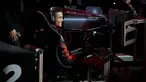 Penyerang Real Madrid, Cristiano Ronaldo tersenyum pada akhir balapan di simulator Formula E selama sebuah acara promosi di Madrid, Spanyol, (23/11). (AP Photo / Paul White)