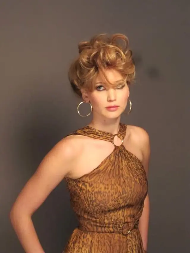 Jennifer Lawrence dalam American Hustle.