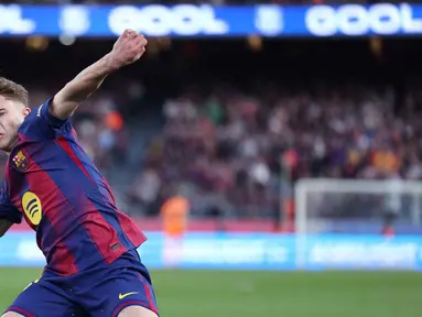 Gelandang Barcelona asal Spanyol, Fermin Lopez, merayakan golnya selama pertandingan pekan ke-25 La Liga 2025/2026 melawan Levante UD di Stadion Camp Nou, Minggu 22 Februari 2026. Barcelona kembali ke puncak klasemen Liga Spanyol 2025/2026. (Josep LAGO/AFP)