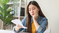 ilustrasi perempuan keuangan/Kmpzzz/Shutterstock