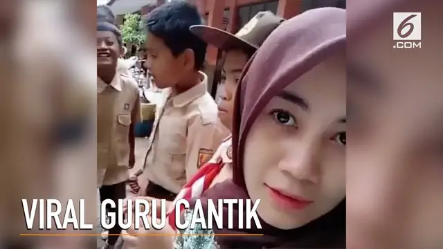 Seorang guru SD jadi perbincangan warganet setelah kecantikannya menghiasi dunia maya.