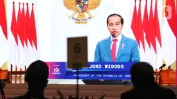 Presiden Joko Widodo memberi sambutan secara virtual pada 
diskusi informal Forum B20 yang diikuti delegasi anggota G20, di Jakarta, Kamis (27/1/2022). Untuk menggenjot pertumbuhan ekonomi dunia diperlukan prinsip keberlanjutan lingkungan guna mencegah pemanasan global. (Liputan6.com/HO/Alwi)