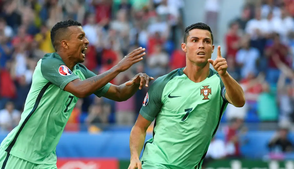 Cristiano Ronaldo mencetak 2 gol saat Portugal ditahan Hungaria, 3-3, pada laga Grup F Piala Eropa 2016 di Stade de Lyon, Lyon, Rabu (22/6/2016). (AFP/Philippe Desmazes)