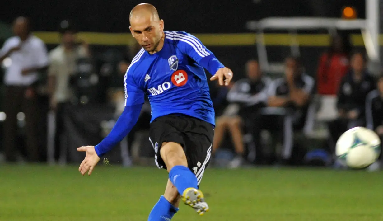 Marco Di Vaio. Setelah 4 musim memperkuat Bologna mulai 2008/2009 hingga 2011/2012, striker kelahiran Roma ini memutuskan berlaga di MLS bersama Montreal Impact, mulai 2012 hingga pensiun pada 2014. Total tampil dalam 76 laga dengan torehan 34 gol dan 10 assist. (AFP/Getty Images/Al Messerschmidt)