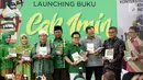 Ketum PKB Muhaimin Iskandar dan para tokoh politik menunjukkan buku karyanya, Jakarta, Minggu (24/9). Buku tersebut berjudul Kontekstualisasi Demokrasi Di Indonesia dan Intoleransi Diskriminasi Dan Politik Multikulturalisme. (Liputan6.com/Johan Tallo)