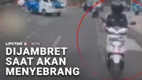 Hati-hati menggunakan ponsel saat berada di pinggir jalan. Seorang perempuan jadi korban jambret saat akan menyeberang jalan di kawasan Tebet, Jakarta.
