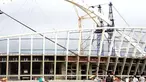 Engineers at Durban's Moses Mabhida 2010 Soccer stadium fit the final piece to the 350 metres long arch over the stadium in Durban on January 13, 2009. AFP PHOTO/RAJESH JANTILAL 