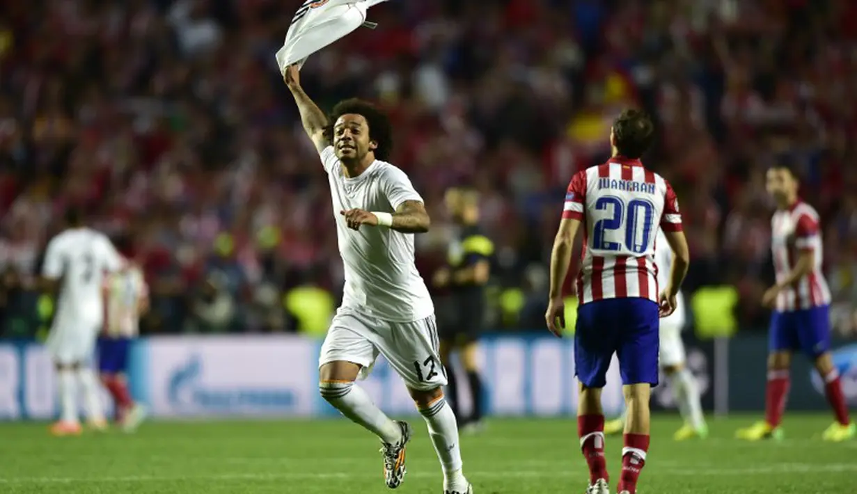  Pemain pengganti Marcelo menambah keunggulan Madrid di menit 118 berkat tendangan keras kaki kiri dari luar kotak penalti. Marcelo luapkan kegembiraannya, Minggu (25/5/2014) dinihari WIB (AFP PHOTO/MIGUEL RIOPA) 