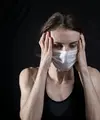 Ilustrasi wanita menderita sakit kepala (Dok. Unsplash/Engin Akyurt)