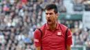 Ekspresi petenis Serbia, Novak Djokovic, setelah menang melawan petenis Austria, Dominic Thiem, dalam semifinal Prancis Terbuka 2016 di Roland Garros, Paris, (3/6/2016). (AFP/Martin Bureau)