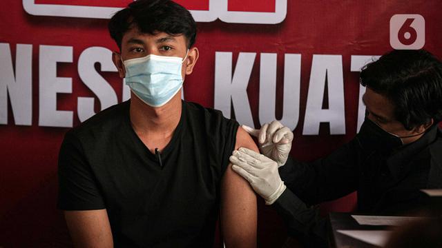 FOTO: Pedagang Pasar Tanah Abang Jalani Vaksinasi Booster COVID-19