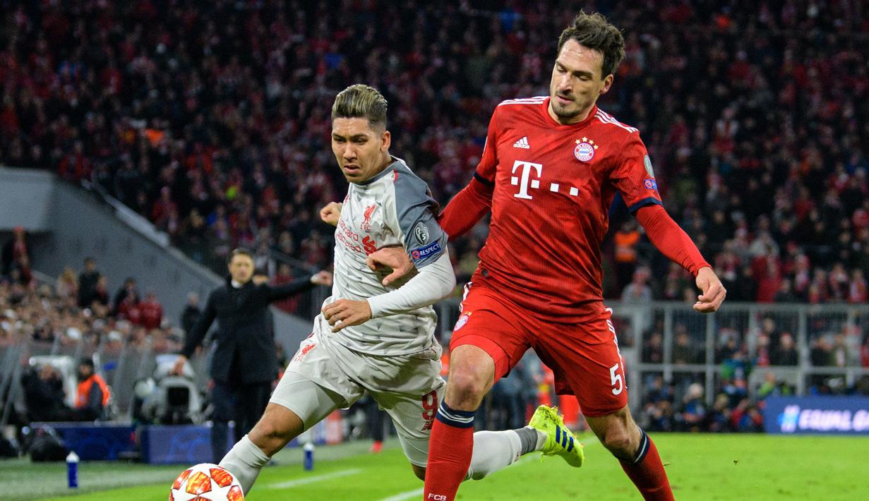 Aksi penyerang Liverpool, Roberto Firminho pada leg kedua, babak 16 besar Liga Champions yang berlangsung di Stadion Allianz Arena, Munchen, Kamis (14/3). Liverpool menang 3-1. (AFP/Mathias Balk)