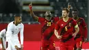 Pemain Belgia, Michy Batshuayi merayakan gol pertamanya ke gawang Swiss dalam pertandingan uji coba Internasional di Stadion King Power, Belgia, Kamis (12/11/2020) dini hari WIB. Belgia mengalahkan Swiss 2-1. (AP Photo/Francisco Seco).