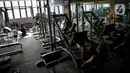 Pengunjung berolahraga di tempat pusat kebugaran Mark Gym di kawasan Tebet, Jakarta, Selasa (5/10/2021). Pemerintah akhirnya membolehkanfitness center kembali beroperasi selama perpanjangan PPKM hingga 18Oktober 2021.  (Liputan6.com/Faizal Fanani)